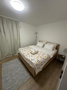 a bedroom with a bed with a lamp on it at Relaxed Getaway by the Sea in Trogir