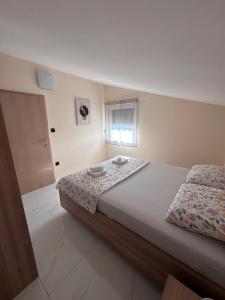 a bedroom with a bed and a window at Villa Asa with private Jacuzzi in Vir +54 photos