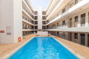an empty swimming pool in an apartment building at Sea waves - Olhão in Olhão