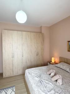 Postel nebo postele na pokoji v ubytování Shkodra Apartments