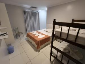 Postel nebo postele na pokoji v ubytování Hotel Vitória - Guaíra