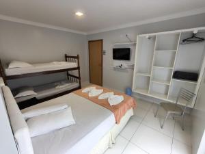 Postel nebo postele na pokoji v ubytování Hotel Vitória - Guaíra