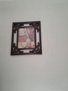 a picture of a painting on a wall at Cozy Nest - Designed for All in Pune