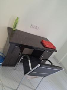 a desk with a chair in a room at Cozy Nest - Designed for All in Pune