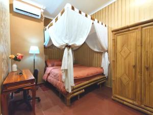 Ένα ή περισσότερα κρεβάτια σε δωμάτιο στο Family villa "Alana" in Sanur +24 φωτογραφίες