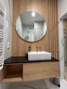 Koupelna v ubytování Aparthotel NAD ZATOKĄ Jezioro Ukiel + 32 fotografií