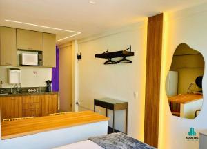 a kitchen with a sink and a table in a room at Jacqueline Vista Mar by Holiday Stays in Fortaleza