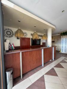 a lobby of a hotel with a reception desk at SUNRISE Suites BAHAMI in Sunny Beach