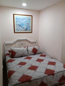 Ένα ή περισσότερα κρεβάτια σε δωμάτιο στο D'harmonis homestay