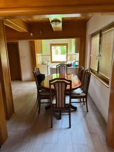 a dining room with a table and chairs at Villa Lavanda in Banja Luka