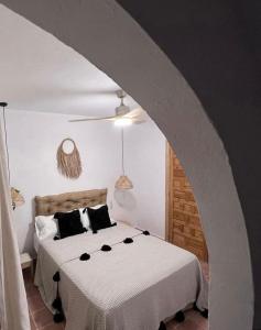 Posteľ alebo postele v izbe v ubytovaní Casa Abades Arcos de la Frontera