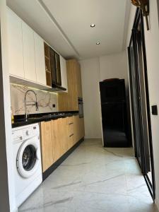 Kuchyň nebo kuchyňský kout v ubytování Aube Hivernage appartement