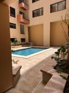 Bazén v ubytování Aube Hivernage appartement nebo v jeho okolí