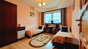 Posteľ alebo postele v izbe v ubytovaní Pokoje Apartamenty Pod Limbą