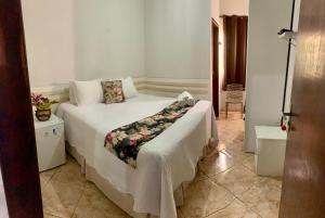a bedroom with a large white bed in a room at Pousada do Guinda DIAMANTINA -MG in Diamantina +153 photos