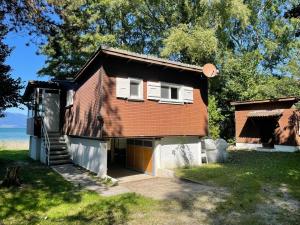a small house with a staircase leading up to it at Le Chalet in Font