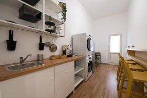 a kitchen with a sink and a counter top at Casa Vacanze Ciccioavo in Vittoria