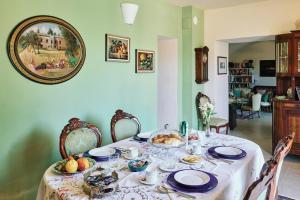 a dining room table with a plate of food on it at Dimora Donna Rita - B&B in Lecce