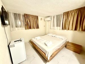 Letto o letti in una camera di Hotel Barbare