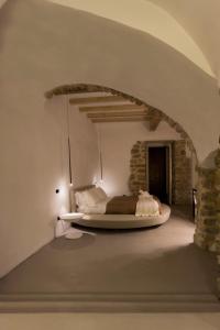 Postel nebo postele na pokoji v ubytování Hotel Diffuso Antichi Ricordi