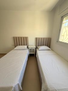 Uma cama ou camas num quarto em Tetouan Relax Apartement