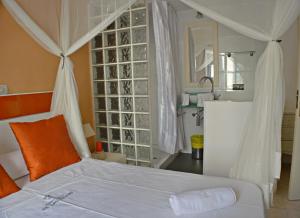 Un ou plusieurs lits dans un hébergement de l'établissement Apartamentos de las Heras