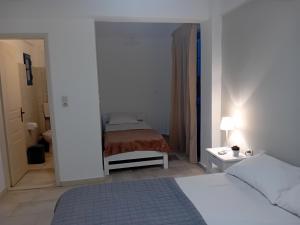 Postel nebo postele na pokoji v ubytování Ippokampos