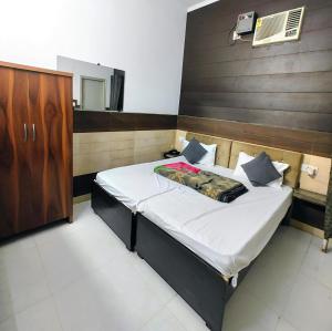 Postel nebo postele na pokoji v ubytování Hotel metroview