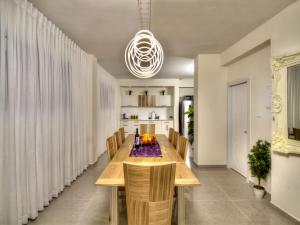 a dining room with a wooden table and chairs at הבית בעתיקה in Safed +5 photos