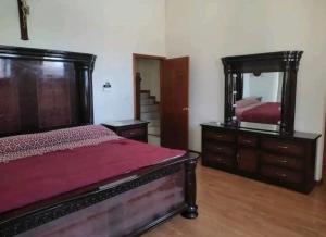 Ένα ή περισσότερα κρεβάτια σε δωμάτιο στο Residencia con Alberca privada y 4 Habitaciones