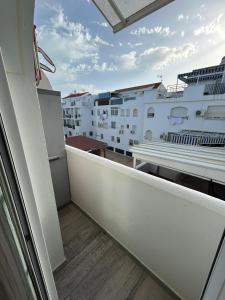 a balcony with a view of a cruise ship at Loft Barbate in Barbate