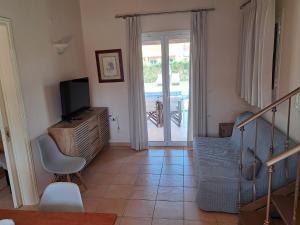 A television and/or entertainment centre at Villa Filia std