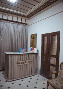 a room with a reception desk and a door at SAIDA Family Guest House in Samarkand
