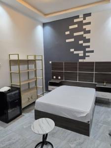 Ένα ή περισσότερα κρεβάτια σε δωμάτιο στο Résidence Teranga walo