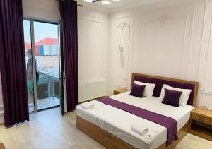 En eller flere senge i et værelse på Mumtoz East Hotel