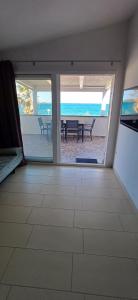 a living room with a view of the beach at Graf-Apartments-Vir-Zadar in Vir