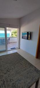 a living room with a view of the beach at Graf-Apartments-Vir-Zadar in Vir