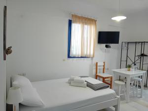 Postel nebo postele na pokoji v ubytování Ippokampos