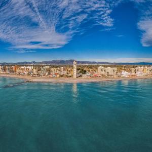 a view of a beach with buildings and the water at Nules Beach Apartment in Moncófar