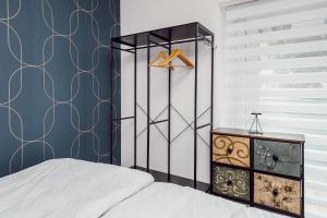 a bedroom with a bed and a dresser and a closet at Alpenrausch 2 in Kiefersfelden
