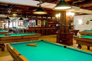 a billiard room with green pool tables at Apartamento Laurus in Albufeira
