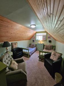 a living room with a couch and a bed at Packwood Ski & Vacation Getaway in Packwood