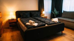 a couch with two teddy bears on it in a living room at Lakeside Olti Apartment near Interlaken in Bönigen