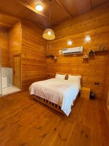 a bedroom with a bed in a wooden room at البساتين فيو in Jeddah +25 photos