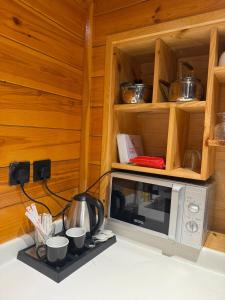 a microwave sitting on top of a kitchen counter at البساتين فيو in Jeddah