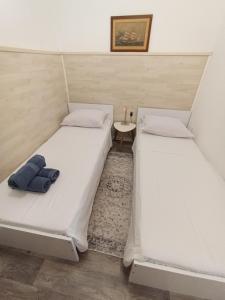 Postel nebo postele na pokoji v ubytování Adriatica Apartments