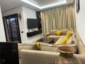 TV a/nebo společenská místnost v ubytování Aube Hivernage appartement