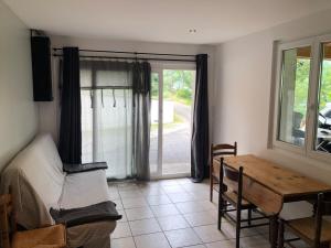 a room with a bed and a table and a window at Appartement Risoul in Risoul