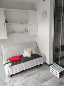 Ένα ή περισσότερα κρεβάτια σε δωμάτιο στο Le B&S