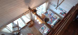 an overhead view of a living room with a ceiling fan at Casuta Schiorului in Mărişel